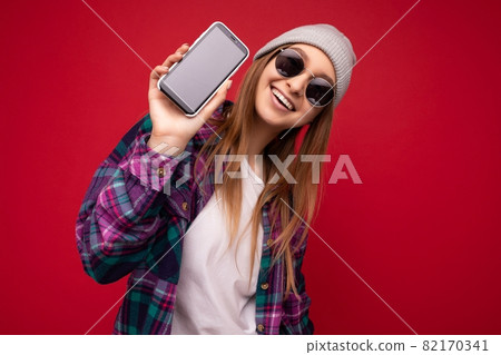 Photo of beautiful smiling young woman good looking wearing casual stylish outfit standing isolated Photo of beautiful smiling young woman good looking wearing casual stylish outfit standing isolated 82170341