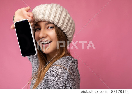 Photo of beautiful smiling young woman good looking wearing casual stylish outfit standing isolated Photo of beautiful smiling young woman good looking wearing casual stylish outfit standing isolated 82170364