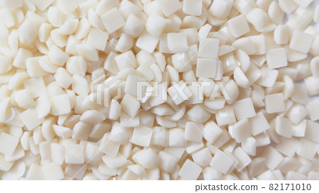 Close-up, white square diamonds for diamond embroidery. Hobbies and DIY, materials for creating diamond embroidery Close-up, white square diamonds for diamond embroidery. Hobbies and DIY, materials for creating diamond embroidery 82171010