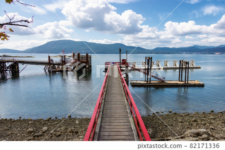 Wooden Pier on the Pacific Ocean West Coast. Wooden Pier on the Pacific Ocean West Coast. 82171336