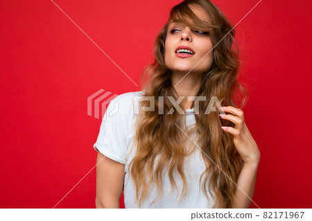 Young beautiful curly blonde woman with sexy expression, cheerful and happy face wearing casual 82171967