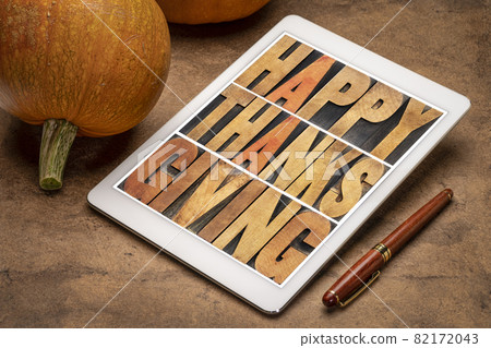 Happy Thanksgiving in wood type on tablet Happy Thanksgiving in wood type on tablet 82172043