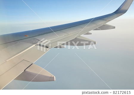 Flying on a plane Flying on a plane 82172615