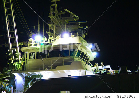Night view photo of a fishing boat moored in the harbor at night_05 Night view photo of a fishing boat moored in the harbor at night_05 82175963