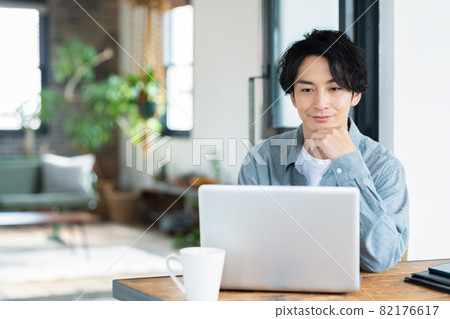 Men's living room telework remote work personal computer lifestyle 82176617