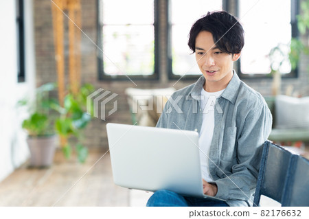 Men's living room telework remote work personal computer lifestyle 82176632