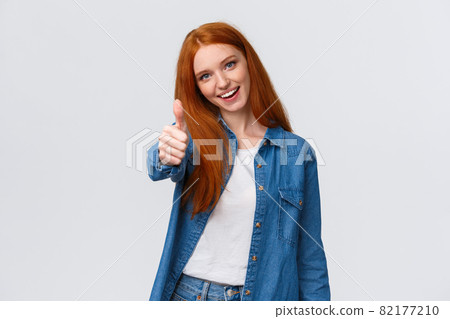 Keep going, its alright. Waist-up portrait cute and confident redhead female team member encourage great teamwork, praise nice job, showing thumb-up and saying yes, approve product, company service Keep going, its alright. Waist-up portrait cute and confident redhead female team member encourage great teamwork, praise nice job, showing thumb-up and saying yes, approve product, company service 82177210