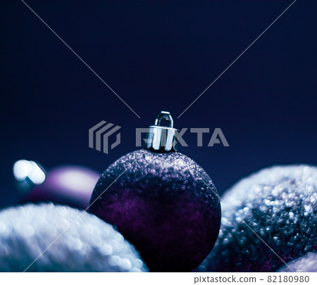 Purple Christmas baubles as festive winter holiday background Purple Christmas baubles as festive winter holiday background 82180980