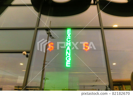 Glowing sign - currency exchange- next to a currency exchange point is seen in Kiev Glowing sign - currency exchange- next to a currency exchange point is seen in Kiev 82182670