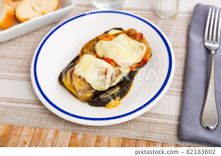 Eggplant with tomato, minced meat and cheese Eggplant with tomato, minced meat and cheese 82183602