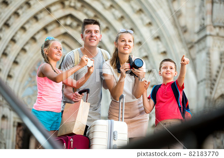 Tourist family of four making amateur photo Tourist family of four making amateur photo 82183770