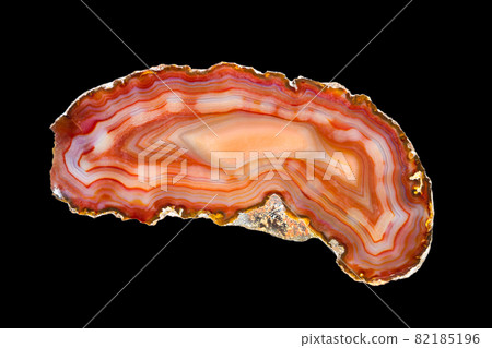 Slice of agate on black background 82185196