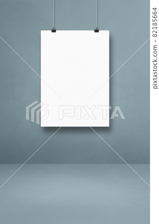 White poster hanging on a grey wall with clips 82185664
