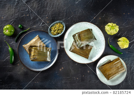 Tamal, traditional dish of Mexican cuisine, various stuffings Tamal, traditional dish of Mexican cuisine, various stuffings 82185724