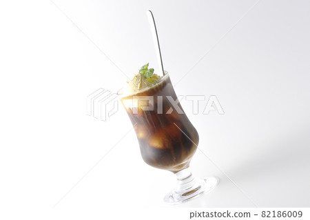 Photographed coffee float with vanilla ice cream melting on a white background 82186009