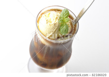 Photographed coffee float with vanilla ice cream melting on a white background 82186020