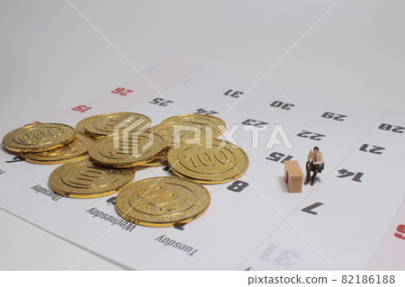 a Business and Planning Concept. Businessman figure standing with  coins 82186188