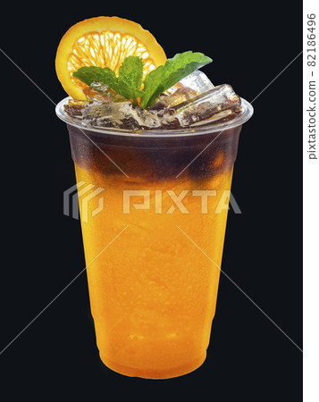 Iced Americano coffee mixed with orange juice with orange slices and mint leaves on isolated. Iced Americano coffee mixed with orange juice with orange slices and mint leaves on isolated. 82186496