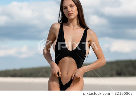 Sensual woman in bikini on beach Sensual woman in bikini on beach 82190802