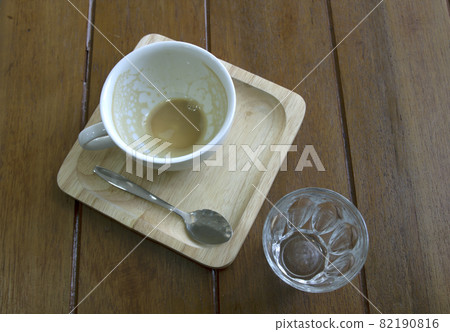 Empty coffee cup after drinking on wooden background. Empty coffee cup after drinking on wooden background. 82190816