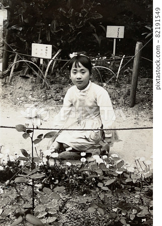 Flower and girl in the Japanese botanical garden in the 1955's Flower and girl in the Japanese botanical garden in the 1955's 82191549
