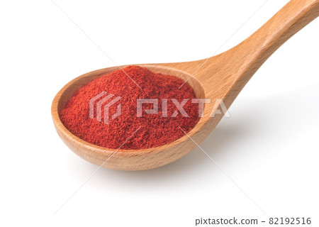 Red paprika powder in wooden spoon Red paprika powder in wooden spoon 82192516