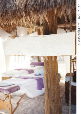 Massage salon with wooden white empty display, mockup 82193032