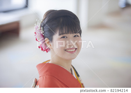 A woman wearing furisode at a coming-of-age ceremony A woman wearing furisode at a coming-of-age ceremony 82194214