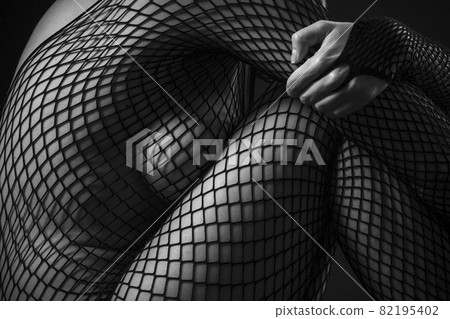 Sexy woman wearing full body fishnet stockings - Stock Photo [82195402] -  PIXTA