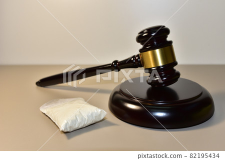 Cocaine and Judge hammer in courtroom. Cocaine and Judge hammer in courtroom. 82195434