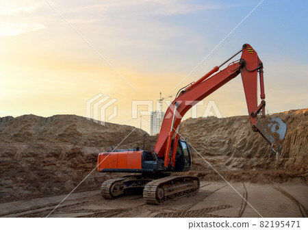 Digging the pit foundation a hole with excavator.  82195471