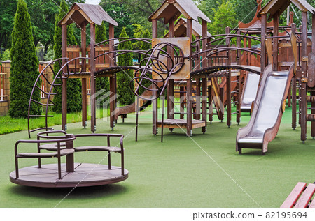 Childrens playground with many attractions made of wood and metal 82195694