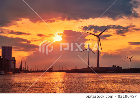Wind turbines in Antwerp port on sunset. Wind turbines in Antwerp port on sunset. 82196457