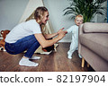 The first steps of the child at the sofa. 82197904
