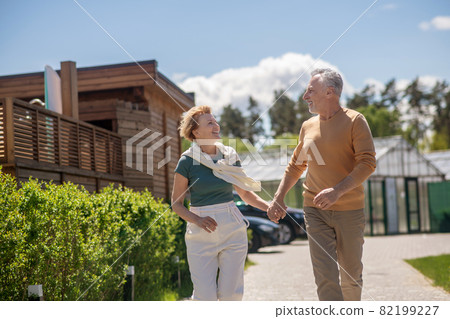 Loving couple gazing at each other during the morning stroll 82199227