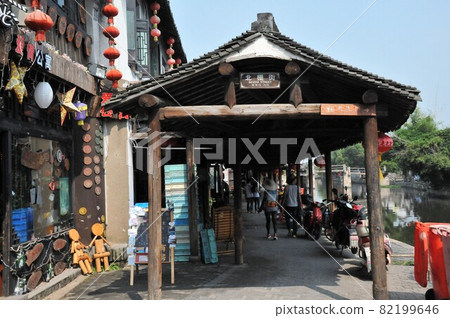 China, Zhejiang Province, Xitang, Smoke and Rain Long Corridor (Arcade), Water Town, Old Town (a charming town with an old townscape) China, Zhejiang Province, Xitang, Smoke and Rain Long Corridor (Arcade), Water Town, Old Town (a charming town with an old townscape) 82199646