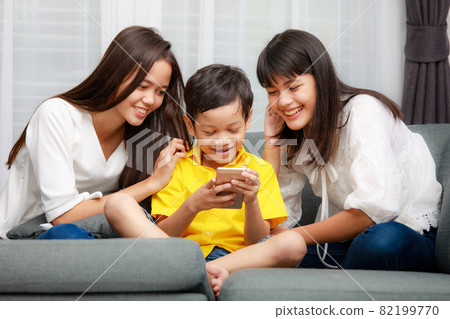 Asian family, boy and girls playing together at home 82199770