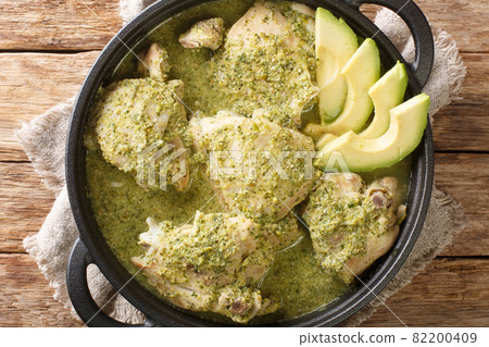 Guatemalan jocon de pollo with tomatillo sauce close up in the plate. Horizontal top view 82200409