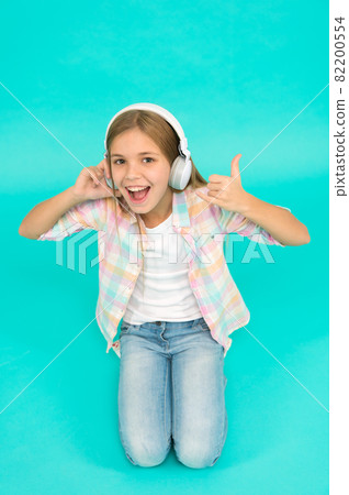 Little girl listen song headphones. Enjoy track of favorite Little girl listen song headphones. Enjoy track of favorite 82200554