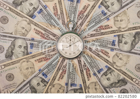 Stopwatch on mandala kaleidoscope from money. 82202580