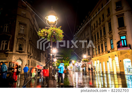 BELGRADE, SERBIA - SEPTEMBER 25: Rainy inght at Knez Mihailova Street on September 25, 2015 in Belgrade, Serbia. Street is the main shopping mile of Belgrade BELGRADE, SERBIA - SEPTEMBER 25: Rainy inght at Knez Mihailova Street on September 25, 2015 in Belgrade, Serbia. Street is the main shopping mile of Belgrade 82202703