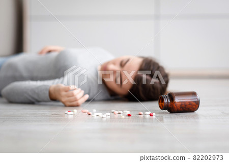 Female with pile of antidepressants kill herself, commit suicide, suffer from mental distress 82202973