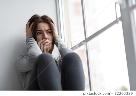 Despaired sad european millennial woman suffering from depression and psychological problems Despaired sad european millennial woman suffering from depression and psychological problems 82203389