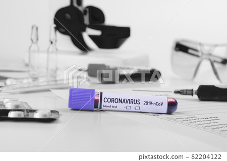 Coronavirus 2019-nCoV concept still life with blood test, drugs and laboratory flasks. COVID-19 background. Coronavirus 2019-nCoV concept still life with blood test, drugs and laboratory flasks. COVID-19 background. 82204122