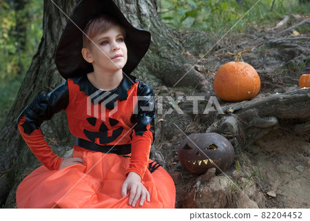 Girl in a witch costume. Beautiful picture for Halloween Girl in a witch costume. Beautiful picture for Halloween 82204452