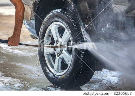Car washing. Cleaning car with high pressure water and foam Car washing. Cleaning car with high pressure water and foam 82205697