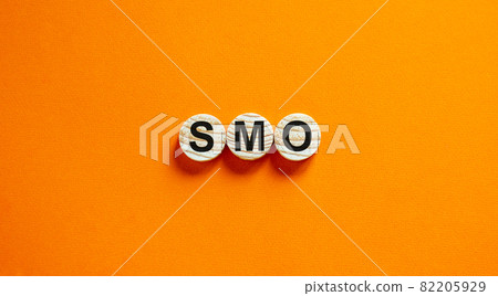 SMO, social media optimization symbol. Wooden circles with word 'SMO - social media optimization' on beautiful orange background, copy space. Business, SMO - social media optimization concept. SMO, social media optimization symbol. Wooden circles with word 'SMO - social media optimization' on beautiful orange background, copy space. Business, SMO - social media optimization concept. 82205929