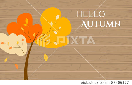 Autumn tree with yellow leaves on light wooden  82206377