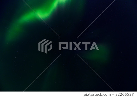 Northern Lights at night sky. Aurora Borealis beautiful polar lights in sky with stars. 82206557