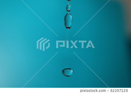 Three water droplets with a mysterious shape of tap water taken with a macro lens 82207228